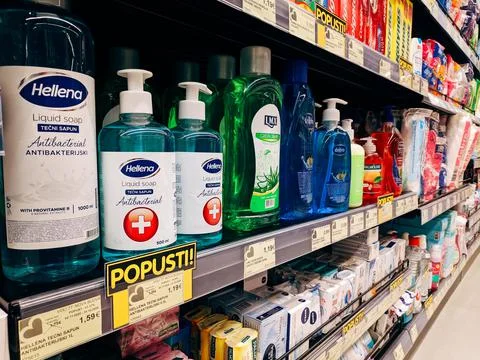 Liquid and solid soap stands on a shelf in a supermarket 스톡 사진