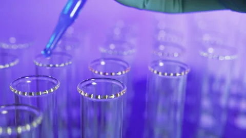 Liquid being dropped into a vial, lab. Biotech, vaccine concepts. 스톡 동영상 133878701