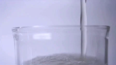 Liquid being poured in a glass Stock Footage 26356890