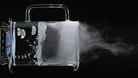Liquid Boils in a Transparent container.  Vertical video Stock Footage 144412575