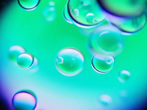 Liquid bubbles rotating slowly Stock Footage 318715992