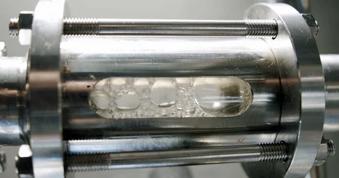 Liquid changes colorinside transparent tube during beer brewing process. Dark Video stock 129026939