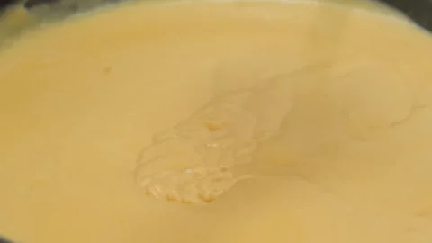 Liquid Cheese Sauce Pouring, Close-Up Stock Footage 331633575