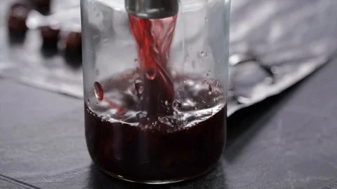 Liquid Cherry Jelly is Filled into a Mason Jar Closeup 動画素材 99163612