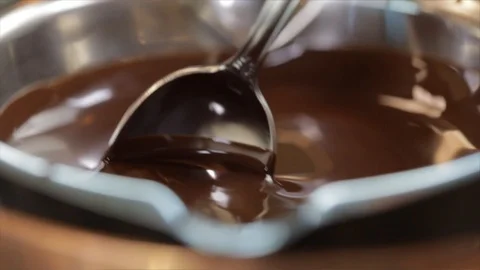Liquid Chocolate is Stirred with a Spoon Closeup No. 1 動画素材 99163671