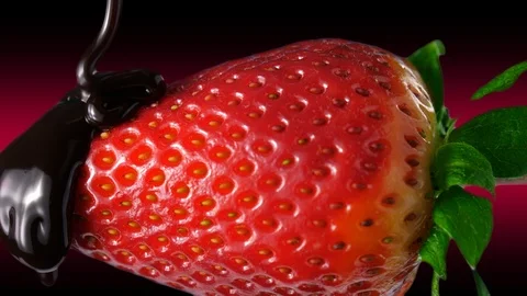Liquid chocolate on a strawberry, close-up view, dark background with red glow Stock Footage 86548364