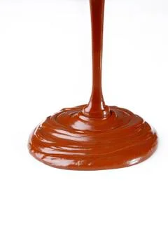 Liquid chocolate on white Foto stock