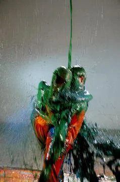 Liquid color paint falling over a couple Fotos Stock