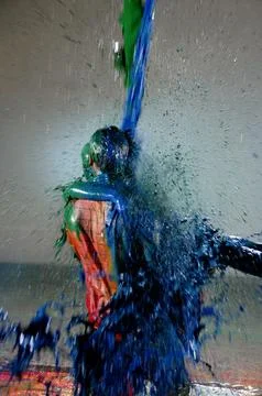 Liquid color paint falling over a couple Fotos Stock