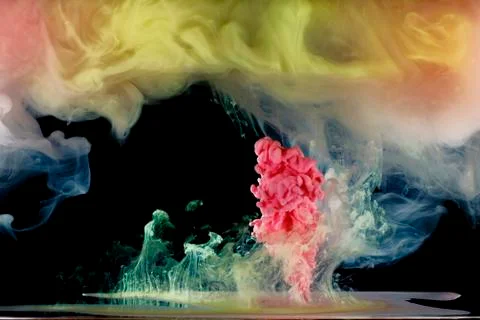 Liquid colored paint mixed moving in fluid Foto stock