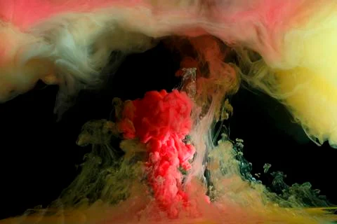 Liquid colored paint mixed moving in fluid Stock Photos