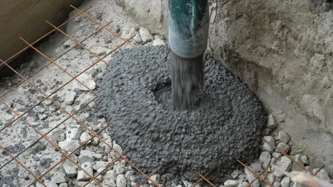 Liquid concrete application pumped from mixer to steel rods mesh reinforcement 库存影片 244658226