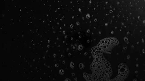 Liquid detergent hitting the front glas lens of a camera Stock Footage 161905409