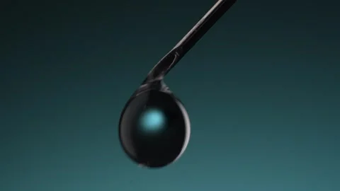 Liquid drips from Tip of Syringe Needle. Stock Footage 260880757