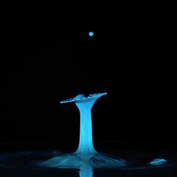 Liquid Drop Art Blue Shape With Black Background Stock Photos