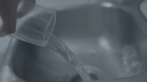 Liquid Elegance: Mesmerizing Slow-Mo Pouring of Clear Water into the Abyss Stock Footage 257292963