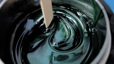 Liquid emerald wax, close-up. Removal of unwanted hair. Shugaring.  Stock Footage 239613500