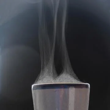 Liquid evaporation. Hot steam. Stock Photos