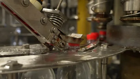 Liquid filling and bottle capping machine for industry. Stock Footage 244007554