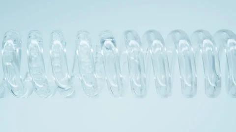 Liquid flows into a glass spiral pipe Stock Footage 248320569