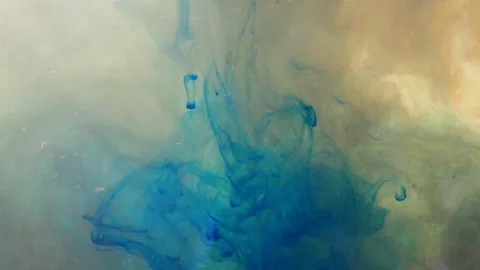 Liquid Flows in Motion flows a bright brown and blue color Mixing Stock Footage 146267458