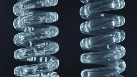 Liquid flows through a spiral glass flask.  Stock Footage 270162062