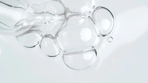 Liquid fluid transparent gel or serum in pipette drips on a white surface. .. Stock Footage 269024548