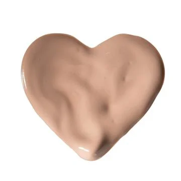 Liquid foundation sample in shape of heart isolated on white background Stock Photos