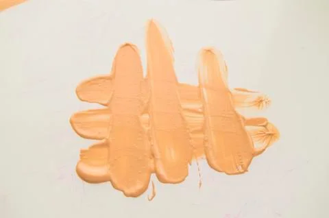 Liquid Foundation stain on white background. Surge of concealer highlighter Foto stock