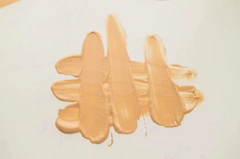 Liquid Foundation stain on white background. Surge of concealer highlighter 스톡 사진