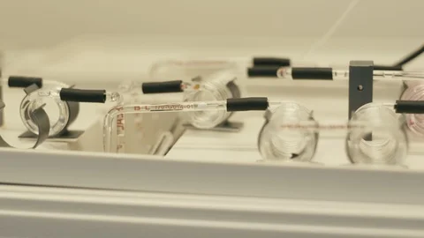 Liquid in glass tubes Stock Footage 121663711