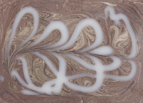 Liquid gold marbled pattern. Beige background Stock Photos