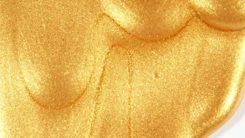 Liquid Gold Motion On The White Background. Macro Shot of Glitter Fluid Metallic Stock Footage 267984506