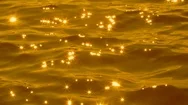 Liquid Gold. Slow Motion Water With Brilliant Sparkles From Sun. Stock Footage