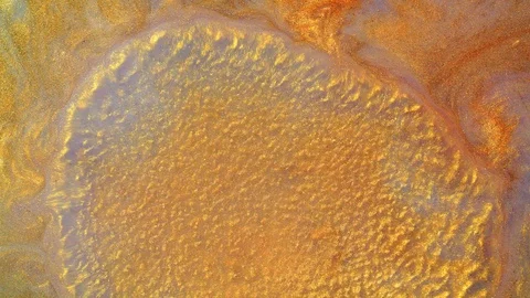 Liquid golden surface boiling with sparkling particles. Gold sand formations Stock Footage 128751936