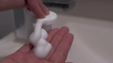 Liquid hand soap Close-up of washing hands to prevent covid bacteria Stock Footage 187488845