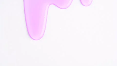Liquid light purple drops of cosmetics product with bubbles flowing on the .. 動画素材 251541456