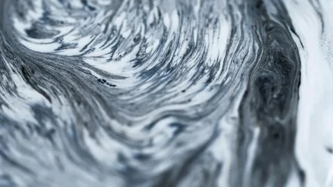 Liquid marble drip mixed ink layers black white Stock Photos