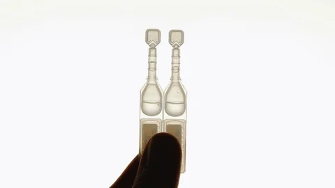 Liquid Medical Sample in Tiny Plastic Pouches Held Upright Stock Footage 124209719
