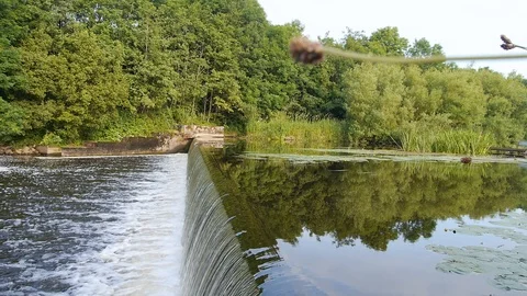 Liquid Mirror breaks on Weir Stock Footage 98294418