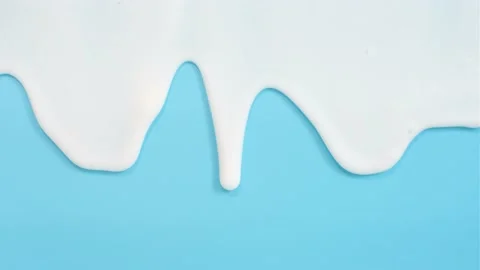 Liquid moisturizing shampoo dripping down on blue background close-up Stock Footage 194420008