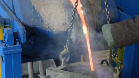 Liquid of molten metal flows in stream at divorce. Stock-Footage 288709457
