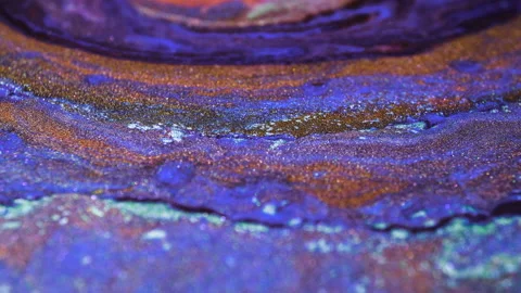 Liquid multi-colored mixed pearlescent paints slowly flow. Abstract multicolored Stock Footage 141648107