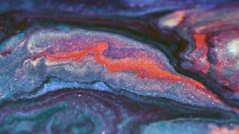 Liquid multi-colored mixed pearlescent paints slowly flow. Abstract multicolored Видео 141648512