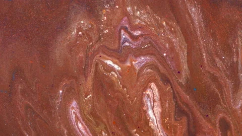 Liquid multi-colored mixed pearlescent paints slowly flow. Abstract multicolored Stock Footage 141983131
