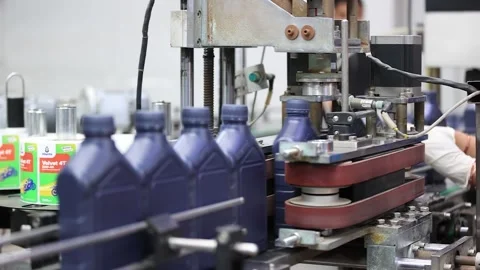 Liquid oil Automatic bottles capping machine at lubricant oil conveyor line Stock Footage 302188051
