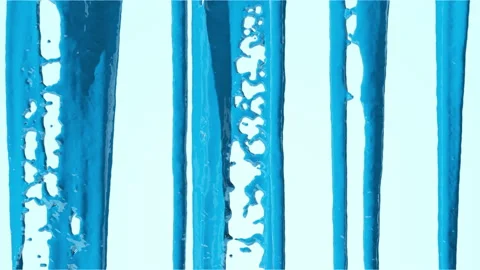 The liquid paint of a dark blue shade pours unevenly from top to bottom. Stock-Footage 238802495