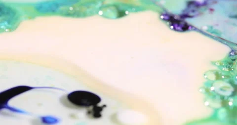 Liquid paint mixing artwork with splash and swirl Stock Footage 151568114