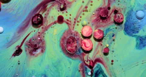 Liquid paint mixing artwork with splash and swirl Stock Footage 151569172