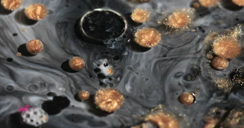 Liquid paint mixing artwork with splash and swirl Stock Footage 153297037